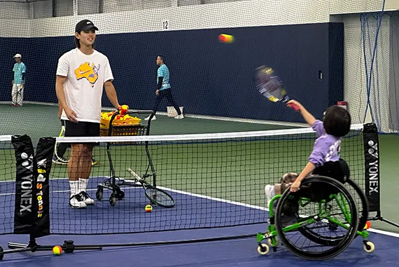 This is a photo showing support for wheelchair tennis. NGK actively supports wheelchair tennis as part of our support for persons with disabilities and local sports.